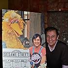 Emilio Delgado poses next to his character Luis' photo, that marked Sesame Street's 1000th episode. Photo dates: Jan 26, 1977 and January 14, 2008. 