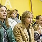 Charlize Theron, Woody Harrelson, Frances McDormand, and Elle Peterson in North Country (2005)