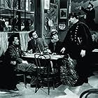 Paul Irving, Paul Muni, Erin O'Brien-Moore, and Vladimir Sokoloff in The Life of Emile Zola (1937)