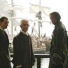 Jack Davenport, Tom Hollander, and David Schofield in Pirates of the Caribbean: Dead Man's Chest (2006)