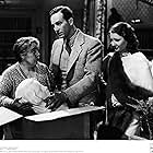 Barbara Stanwyck, David Manners, and Beryl Mercer in The Miracle Woman (1931)