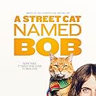 Luke Treadaway and Bob the Cat in A Street Cat Named Bob (2016)