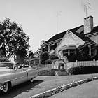 Frankie Laine in his Cadillac, wife Nan Grey and his kids in Los Angeles, CA