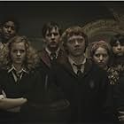 Alfred Enoch, Rupert Grint, Matthew Lewis, Devon Murray, Emma Watson, Georgina Leonidas, Afshan Azad, Shefali Chowdhury, Jessie Cave, and Isabella Laughland in Harry Potter and the Half-Blood Prince (2009)