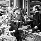 Alec Guinness, Dennis Price, and Anne Valery in Kind Hearts and Coronets (1949)