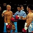 Vince and Cesar get instruction from the ref (Darrel Foster), flanked by their trainers, played by Eloy Casados (left) and Henry G. Sanders (right).  Famed ring announcer, Michael Buffer stands behind the ref. 