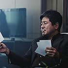 Choi Min-sik in New World (2013)