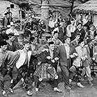 Gene Kelly, Van Johnson, Buddy Bryan, Llorna Jordon, Eddie Quillan, Gregor Momdjian, and Jimmy Brooks in Brigadoon (1954)