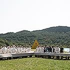 Mats Blomgren, Julia Ragnarsson, Will Poulter, William Jackson Harper, Jack Reynor, Ellora Torchia, Anders Back, Archie Madekwe, Hampus Hallberg, and Vilhelm Blomgren in Midsommar (2019)