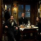 Jude Law, Stephen Fry, Noomi Rapace, and Jack Laskey in Sherlock Holmes: A Game of Shadows (2011)