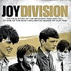 Ian Curtis, Peter Hook, Stephen Morris, Bernard Sumner, and Joy Division in Joy Division (2007)