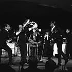 Peter Lawford, Dean Martin, Joey Bishop, Frank Sinatra, Sammy Davis Jr. and Buddy Lester performing in the Copa Room at the Sands Hotel in Las Vegas