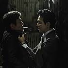 Choi Min-sik and Lee Jung-jae in New World (2013)