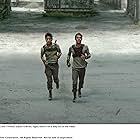 Dylan O'Brien and Ki Hong Lee in The Maze Runner (2014)