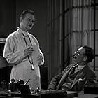Walter Huston and John St. Polis in The Criminal Code (1930)