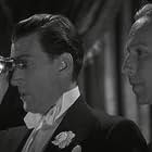 Lloyd Nolan and Walter Pidgeon in Big Brown Eyes (1936)