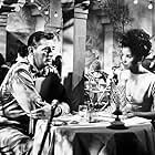 Robert Mitchum and France Nuyen in The Winston Affair (1964)