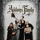 Christina Ricci, Raul Julia, Christopher Lloyd, Anjelica Huston, Judith Malina, Carel Struycken, and Jimmy Workman in The Addams Family (1991)