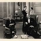 Basil Rathbone, Herbert Bunston, Moon Carroll, and Mackenzie Ward in The Lady of Scandal (1930)