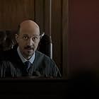 Still of AMRO SALAMA as Judge Thompson on Proven Innocent and Acceptable Losses.