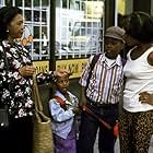Alfre Woodard, Mary Alice, Kulani Hassen, and Mpho Koaho in Down in the Delta (1998)