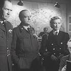 Walter Fitzgerald, Ian Hunter, Dinah Sheridan, and Richard Wattis in Raiders in the Sky (1953)