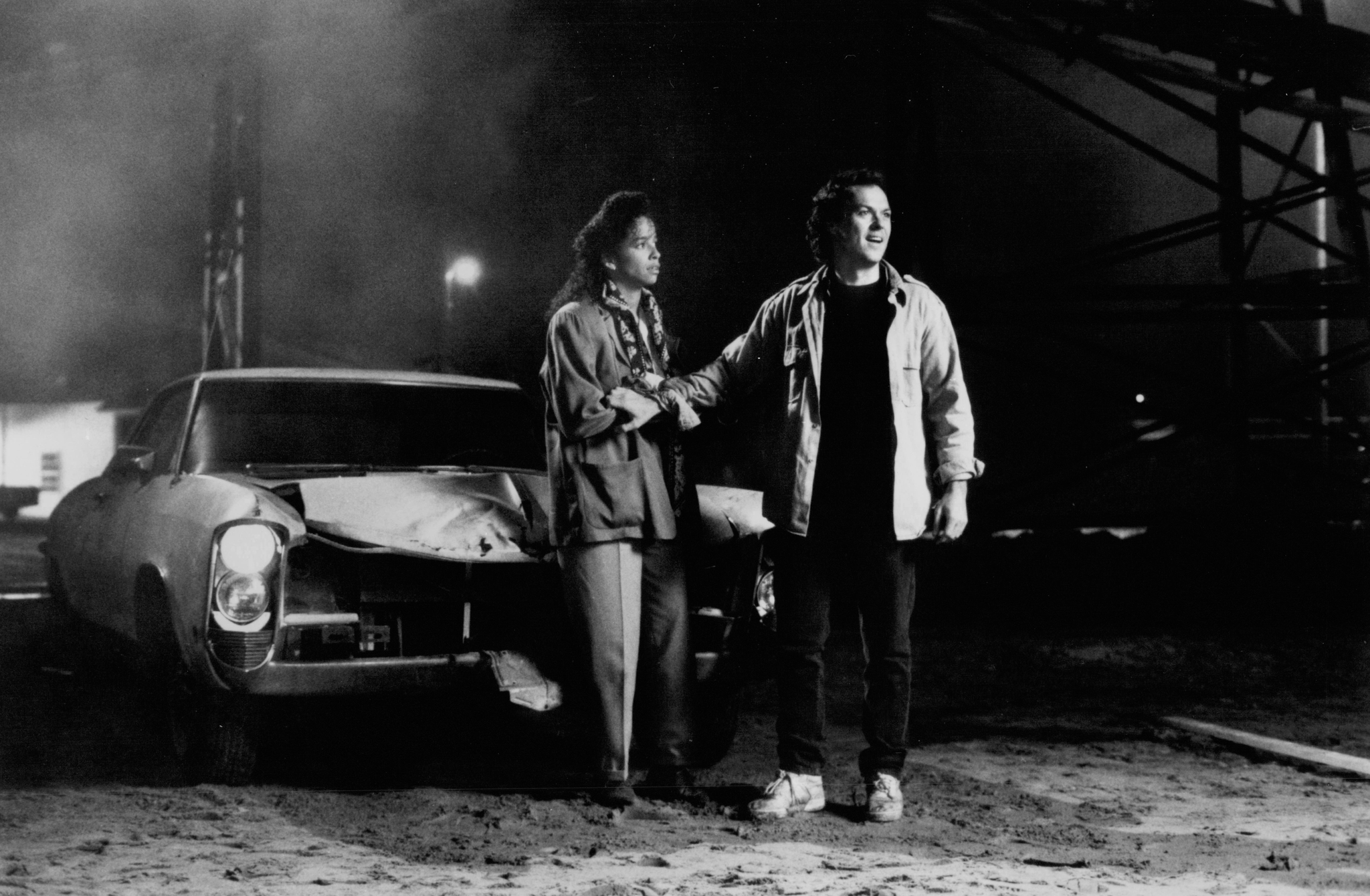 Michael Keaton and Rae Dawn Chong in The Squeeze (1987)
