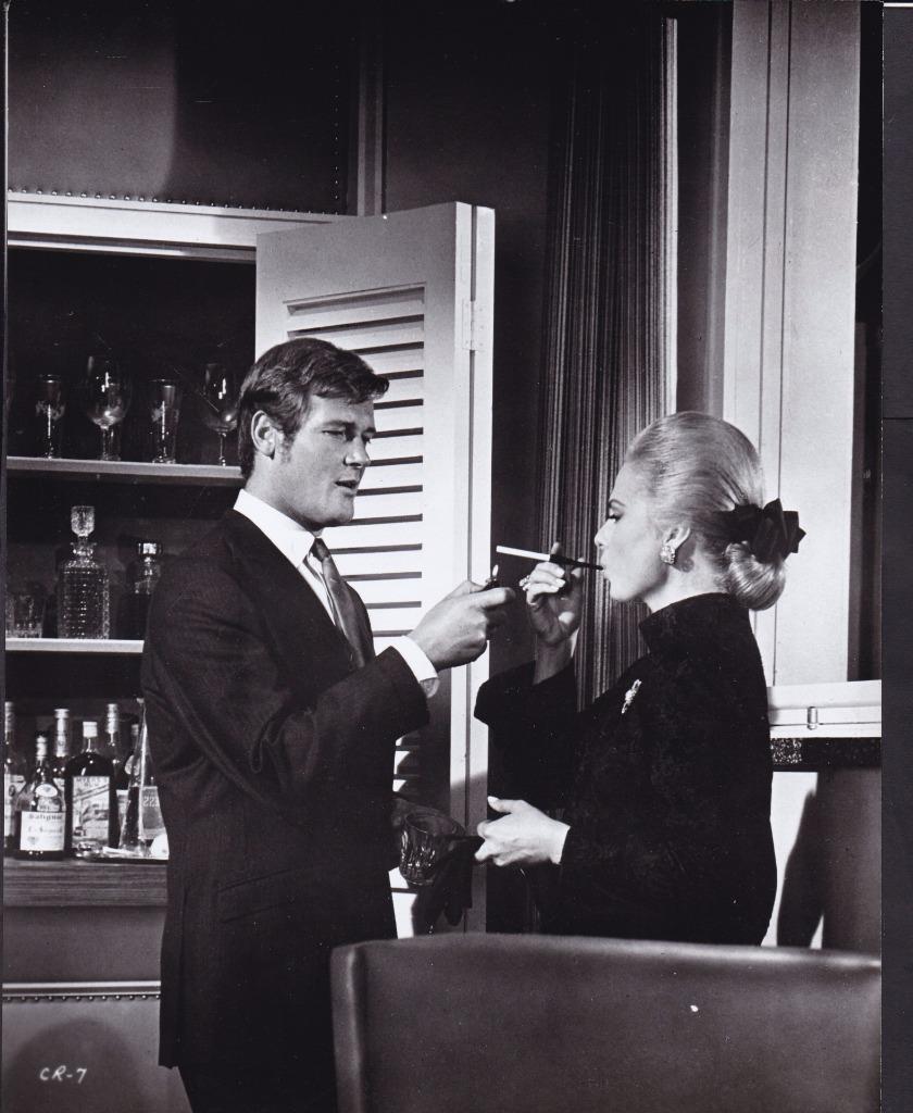 Roger Moore and Martha Hyer in Crossplot (1969)