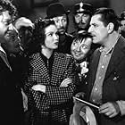 Peter Lorre, John Carradine, Warner Baxter, Charles Halton, Jean Hersholt, and Marjorie Weaver in I'll Give a Million (1938)