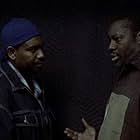 Mykelti Williamson and Bruce A. Young in Boomtown (2002)