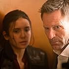 Aaron Eckhart and Nina Dobrev in The Bricklayer (2023)