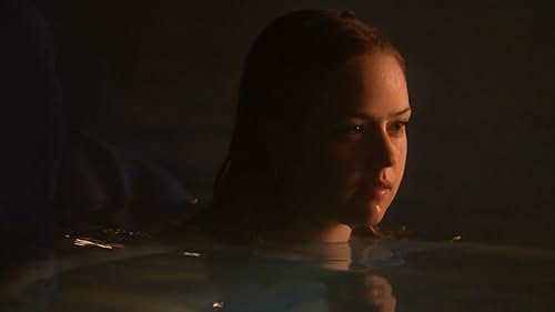 A woman swimming in her pool at night is terrorized by an evil spirit.