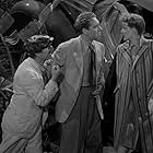 Bette Davis, Paul Henreid, and Frank Puglia in Now, Voyager (1942)