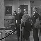 Alan Baxter, Henry Brandon, and Walter Pidgeon in Big Brown Eyes (1936)