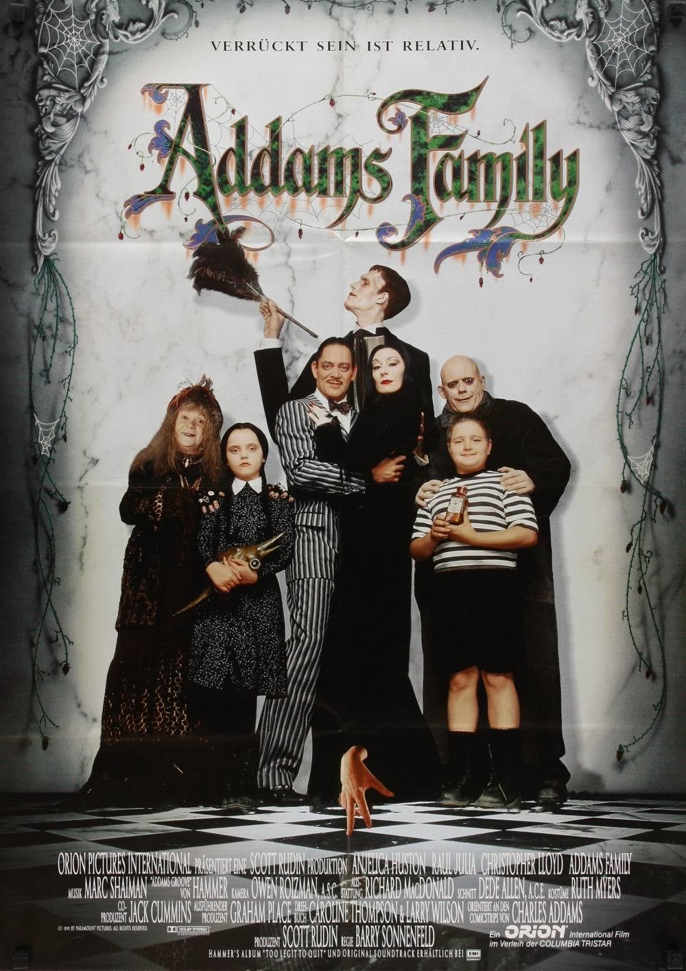 Christina Ricci, Raul Julia, Christopher Lloyd, Anjelica Huston, Judith Malina, Carel Struycken, and Jimmy Workman in The Addams Family (1991)