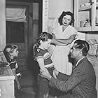 Glenn Ford, Nadine Ashdown, Ruth Roman, and Donna Corcoran in Young Man with Ideas (1952)