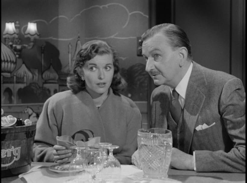 Raymond Huntley and Eileen Moore in The Green Man (1956)