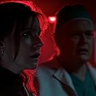 Christian Clemenson and Jacqueline McKenzie in Malignant (2021)