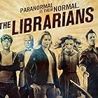 Rebecca Romijn, Lindy Booth, Christian Kane, John Larroquette, and John Harlan Kim in The Librarians (2014)