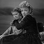 Constance Bennett and Betty Brewer in Wild Bill Hickok Rides (1942)
