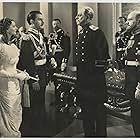 Oscar Apfel, Elizabeth Allan, Paul Harvey, and Anton Walbrook in The Soldier and the Lady (1937)