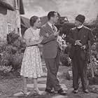 Constance Cummings, Aubrey Mallalieu, and Robert Montgomery in Haunted Honeymoon (1940)