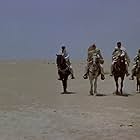 Anthony Quinn, Robert Brown, and Takis Emmanuel in The Lion of the Desert (1980)