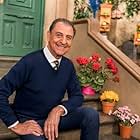 Emiio Delgado 'Luis' on the stoop of 123 Sesame Street at the 50th Anniversary Special 2019