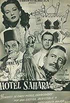 Yvonne De Carlo, Peter Ustinov, Roland Culver, and David Tomlinson in Hotel Sahara (1951)