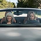 Catherine O'Hara and Emily Blunt in Pain Hustlers (2023)