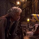 Tom Hanks and Benjamin Evan Ainsworth in Pinocchio (2022)