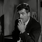 Larry Taylor in Spin a Dark Web (1956)