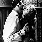 Arlene Dahl and Jack Hawkins in She Played with Fire (1957)