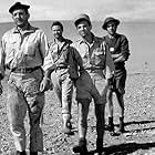 Charles Aznavour, Maurice Biraud, Germán Cobos, and Lino Ventura in Taxi for Tobruk (1961)